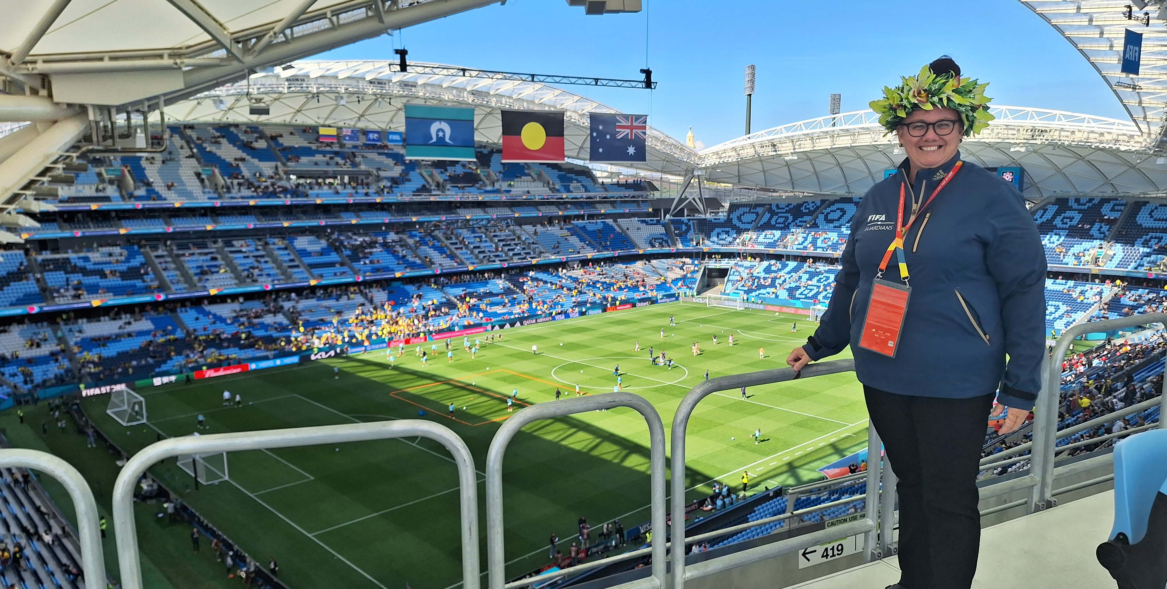 A woman standing in an empty stadium
