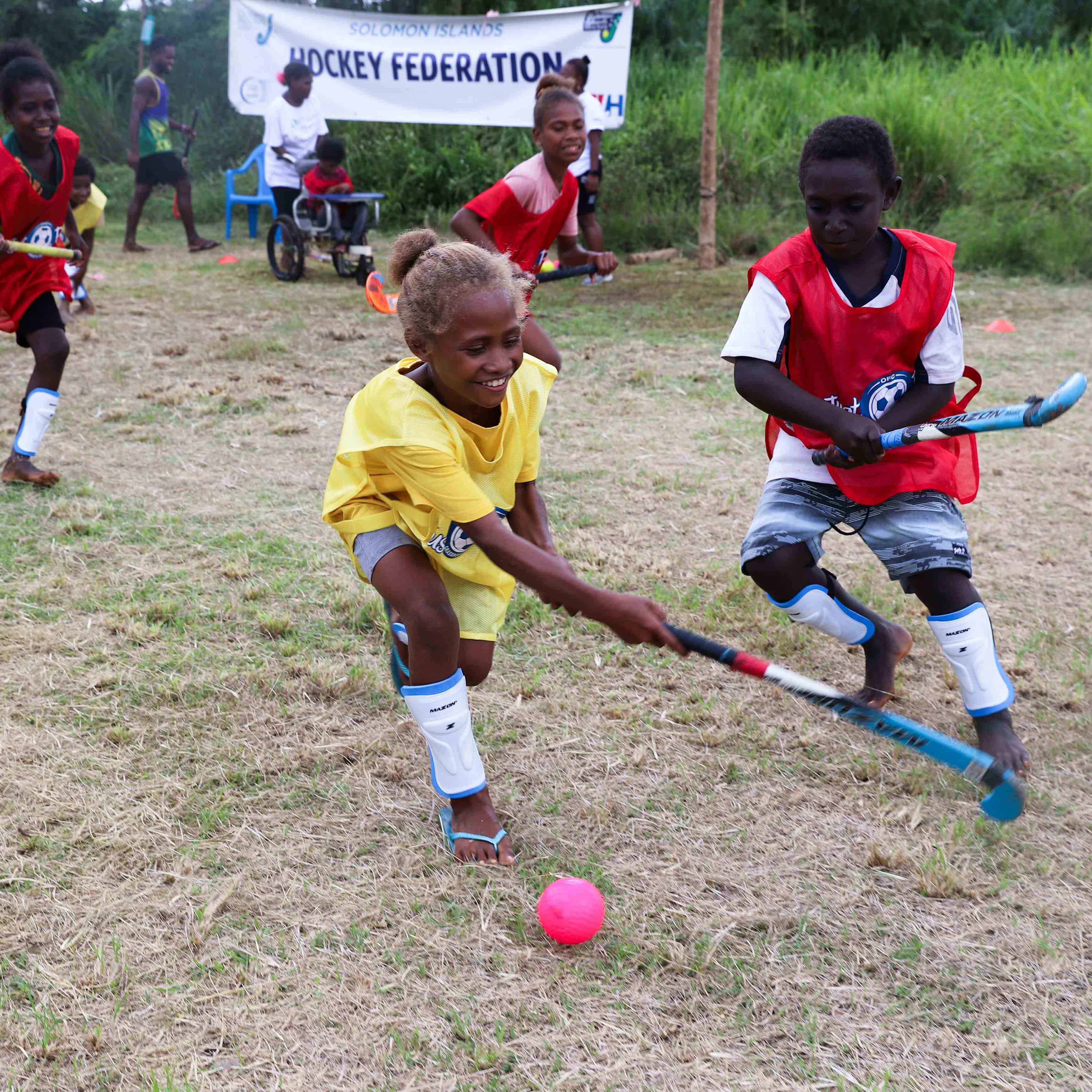Children playing hockey