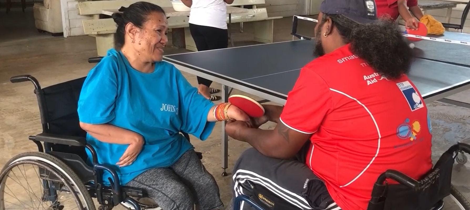 People with disability prepare to play table tennis