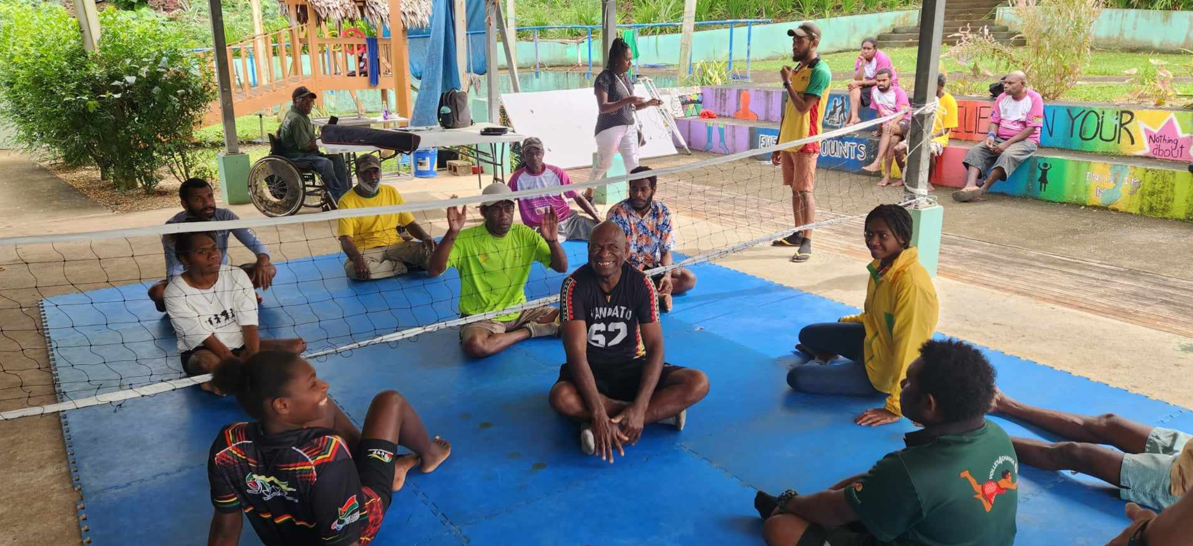 People with disability play sitting volleyball 