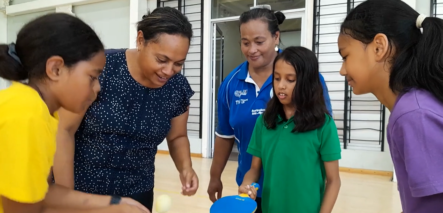 Children in Fiji learning table tennis skills