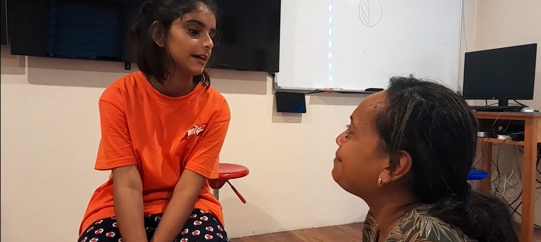 Teacher talking to her female student