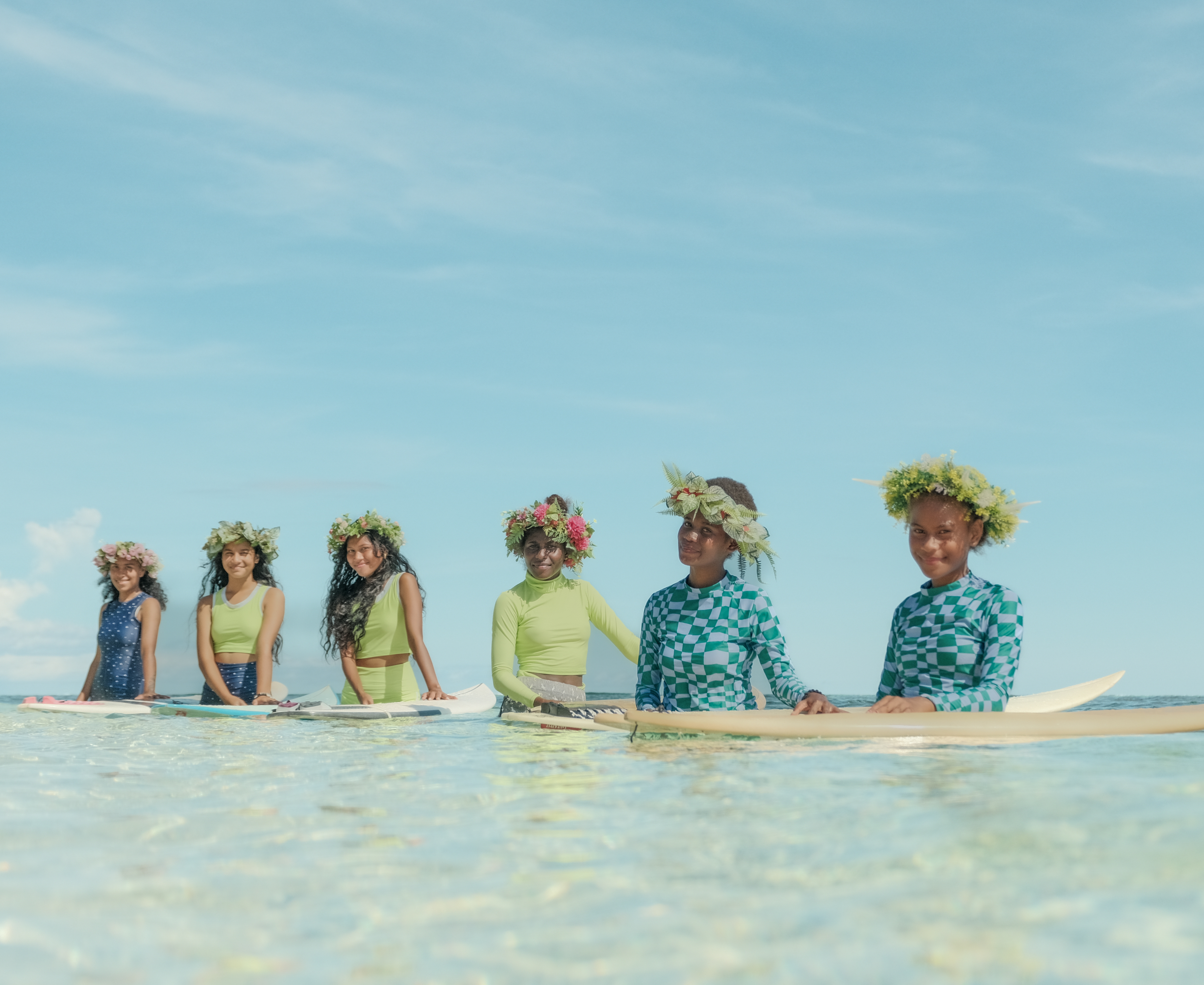 Girls surfing in Solomon Islands 