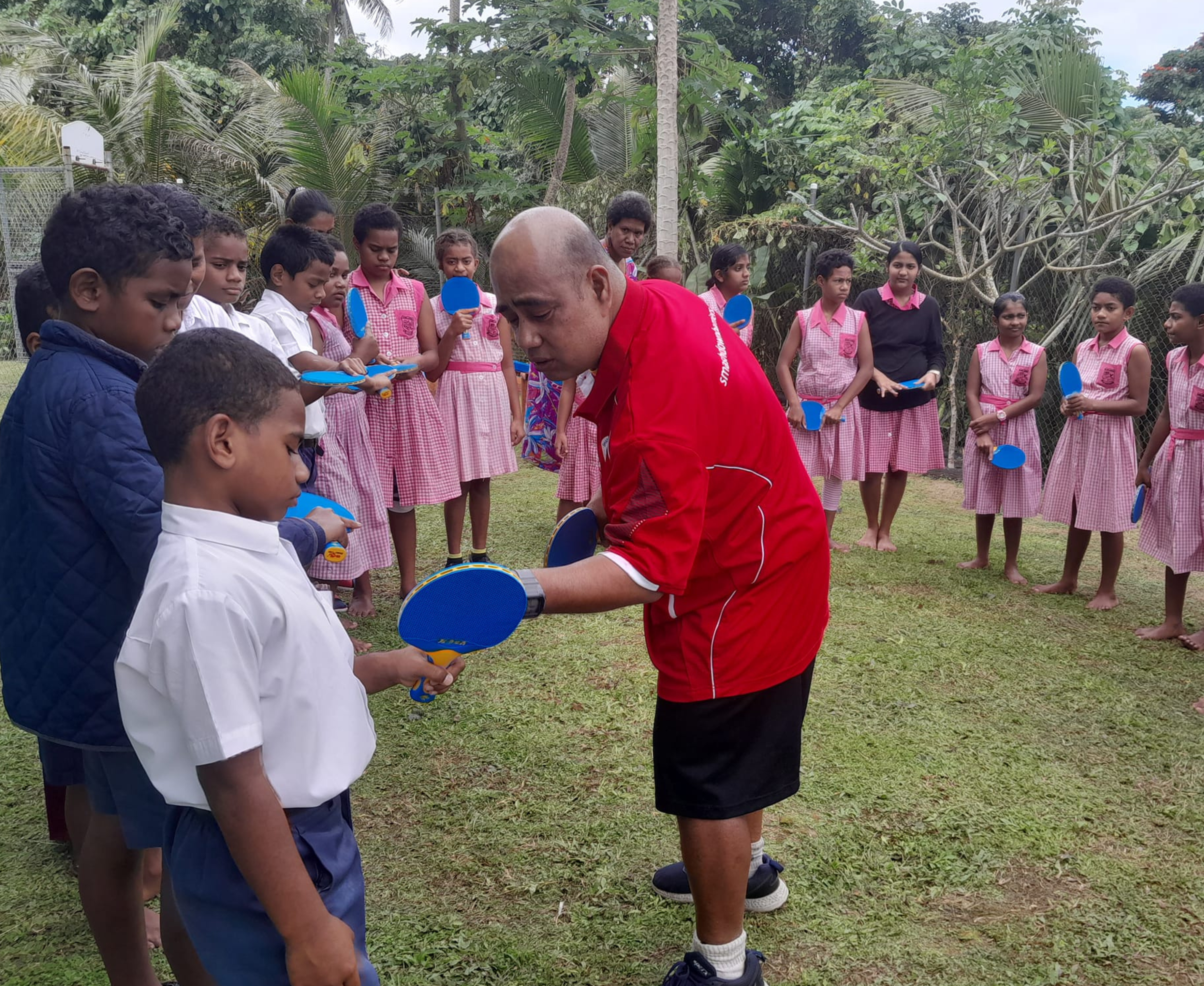 Children learn table tennis