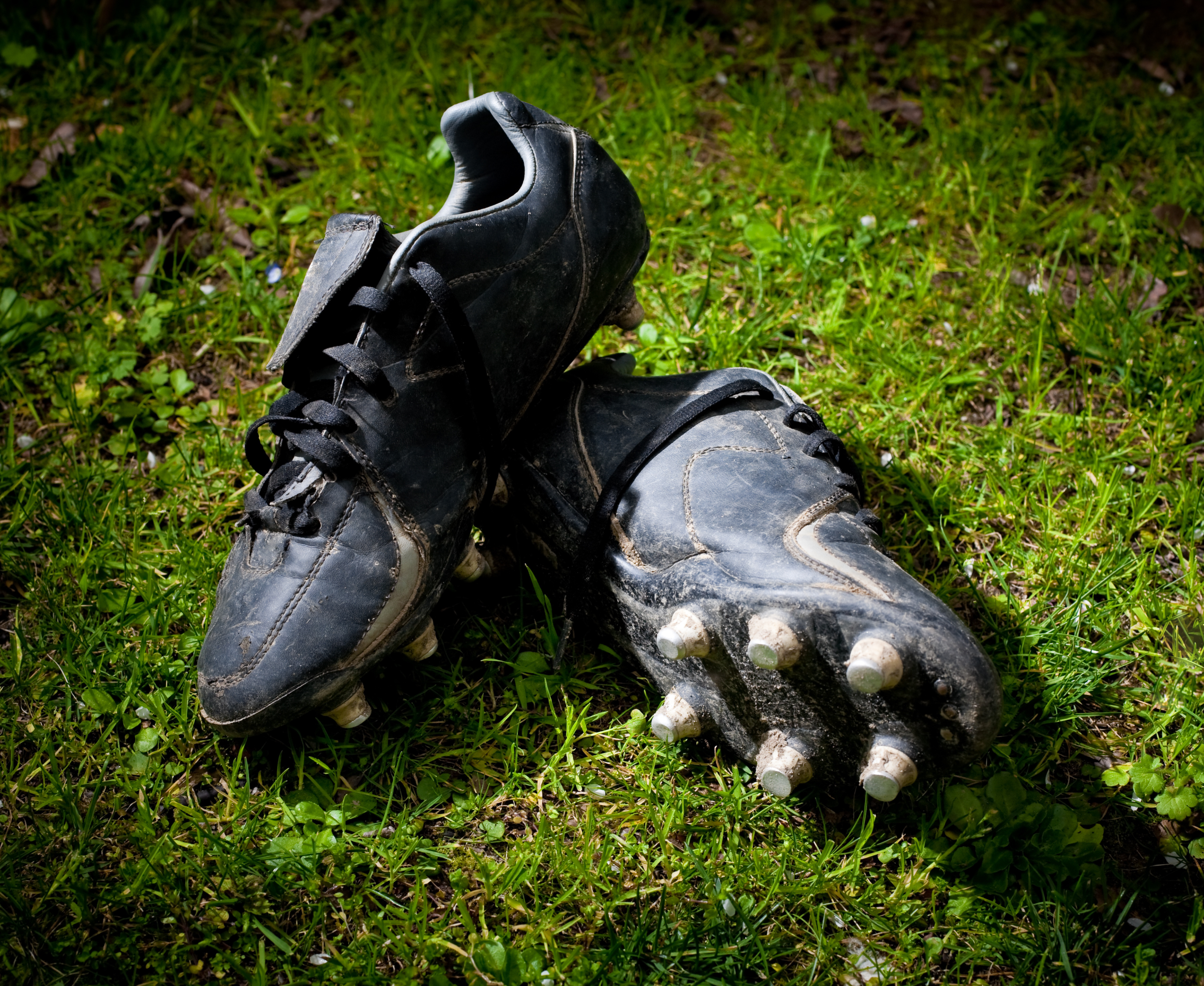 a pair of rugby boots on the field