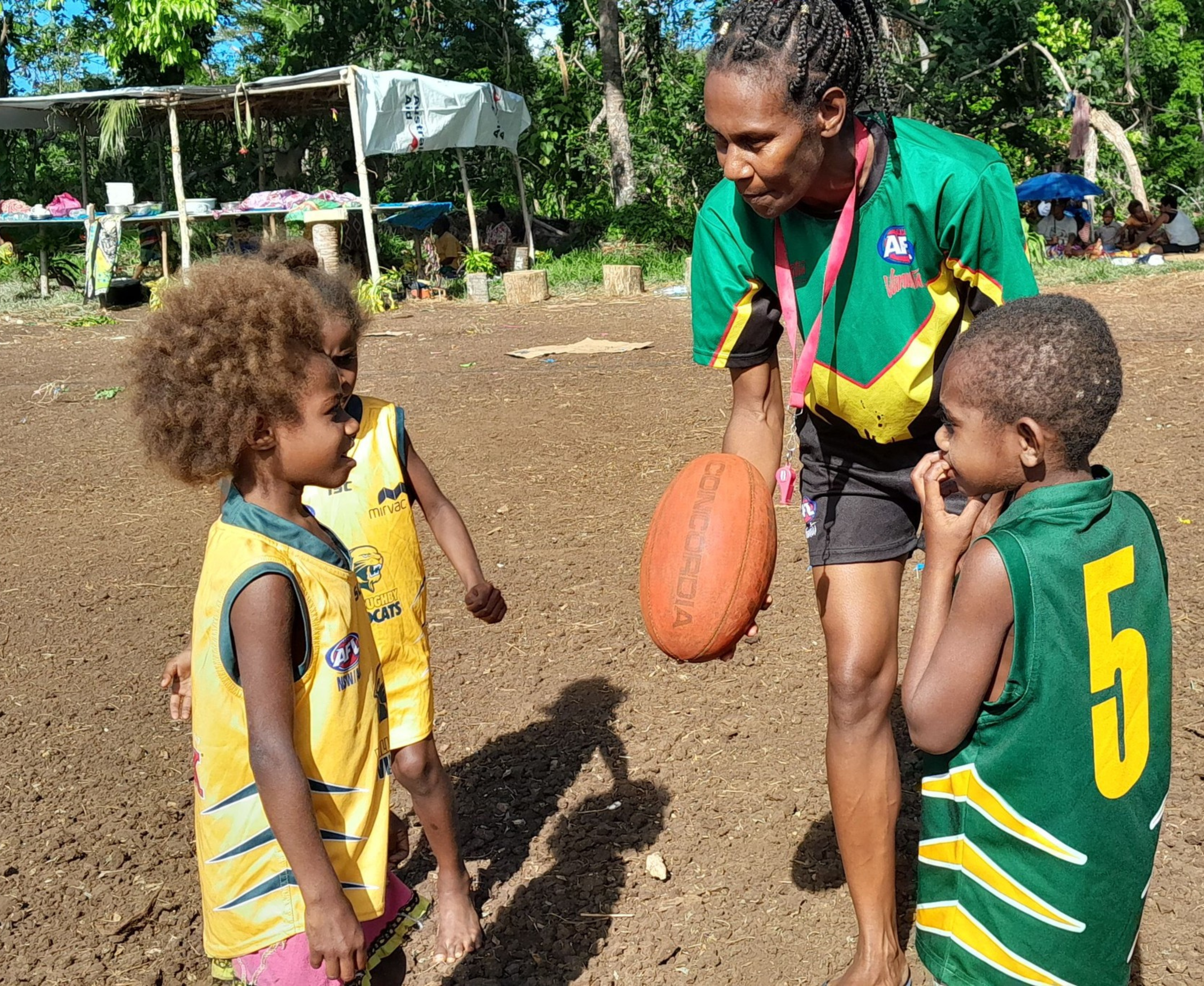 Kids listening to their AFL coach 