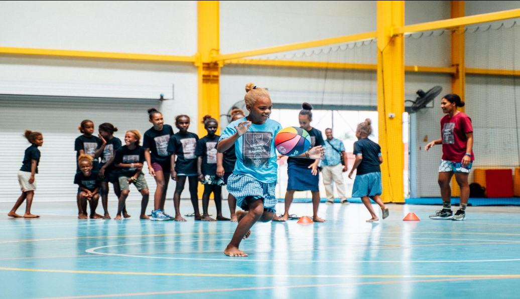 Young girl enjoys basketball 