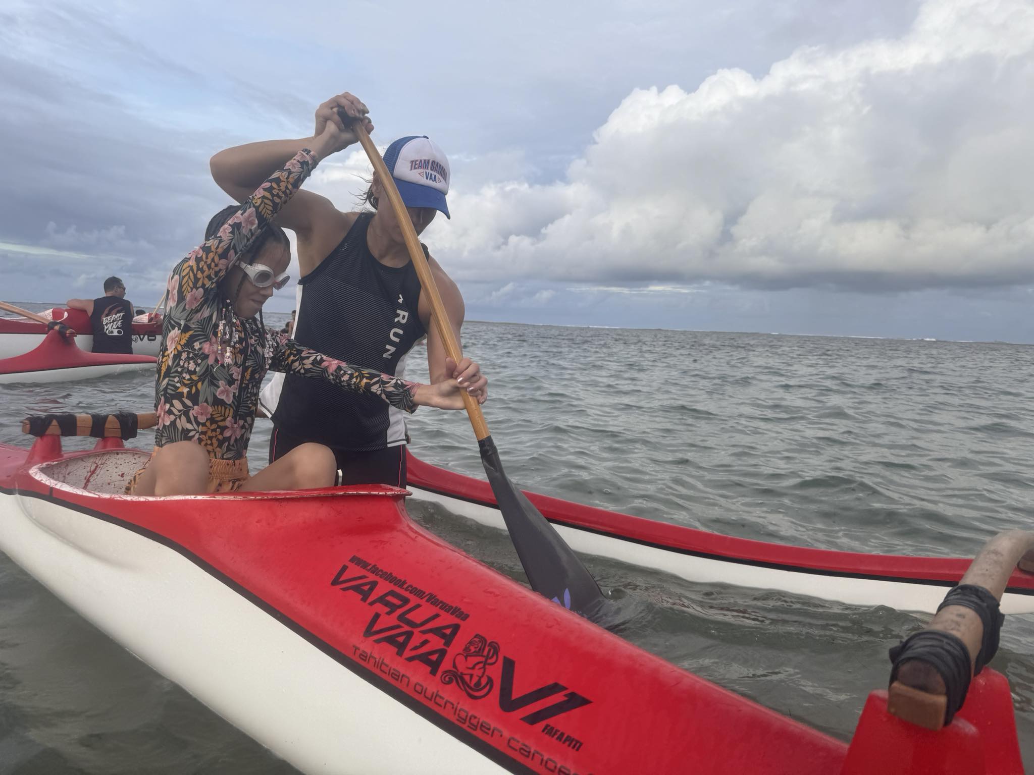 A young girl learns to paddle