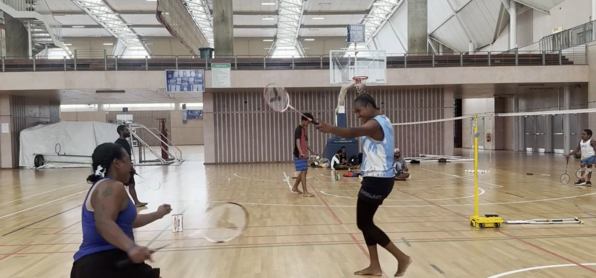 Girls playing modified badminton