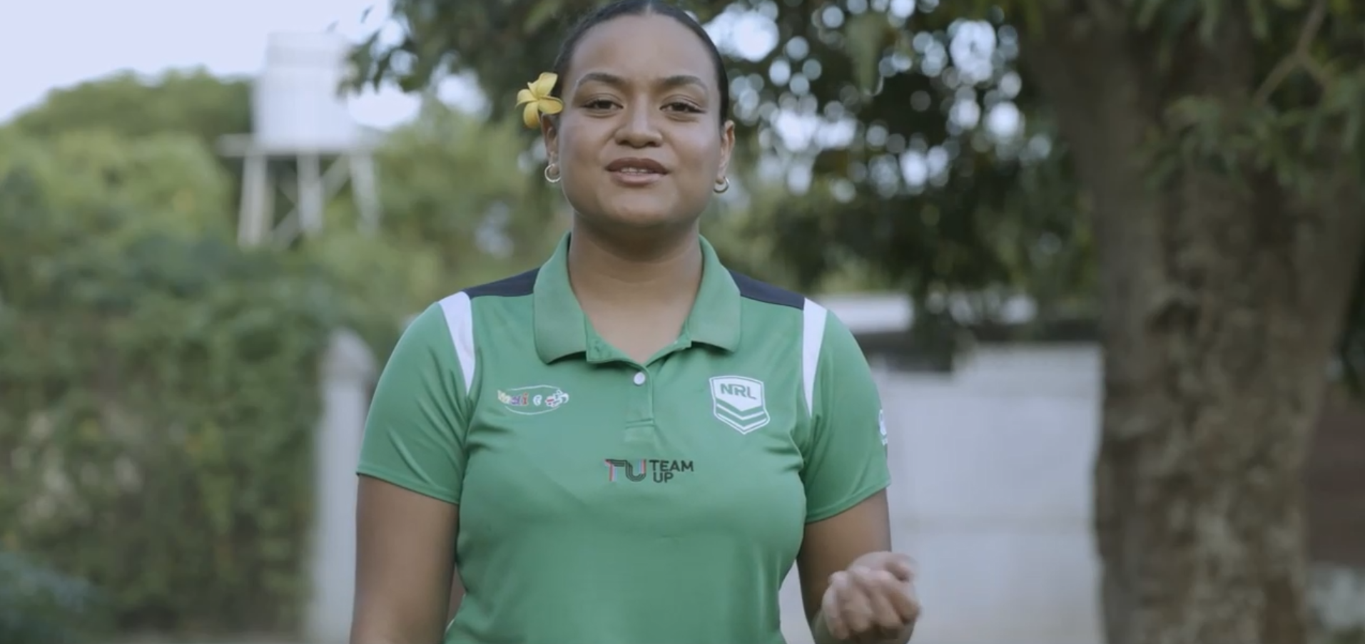 A young woman speaks to camera
