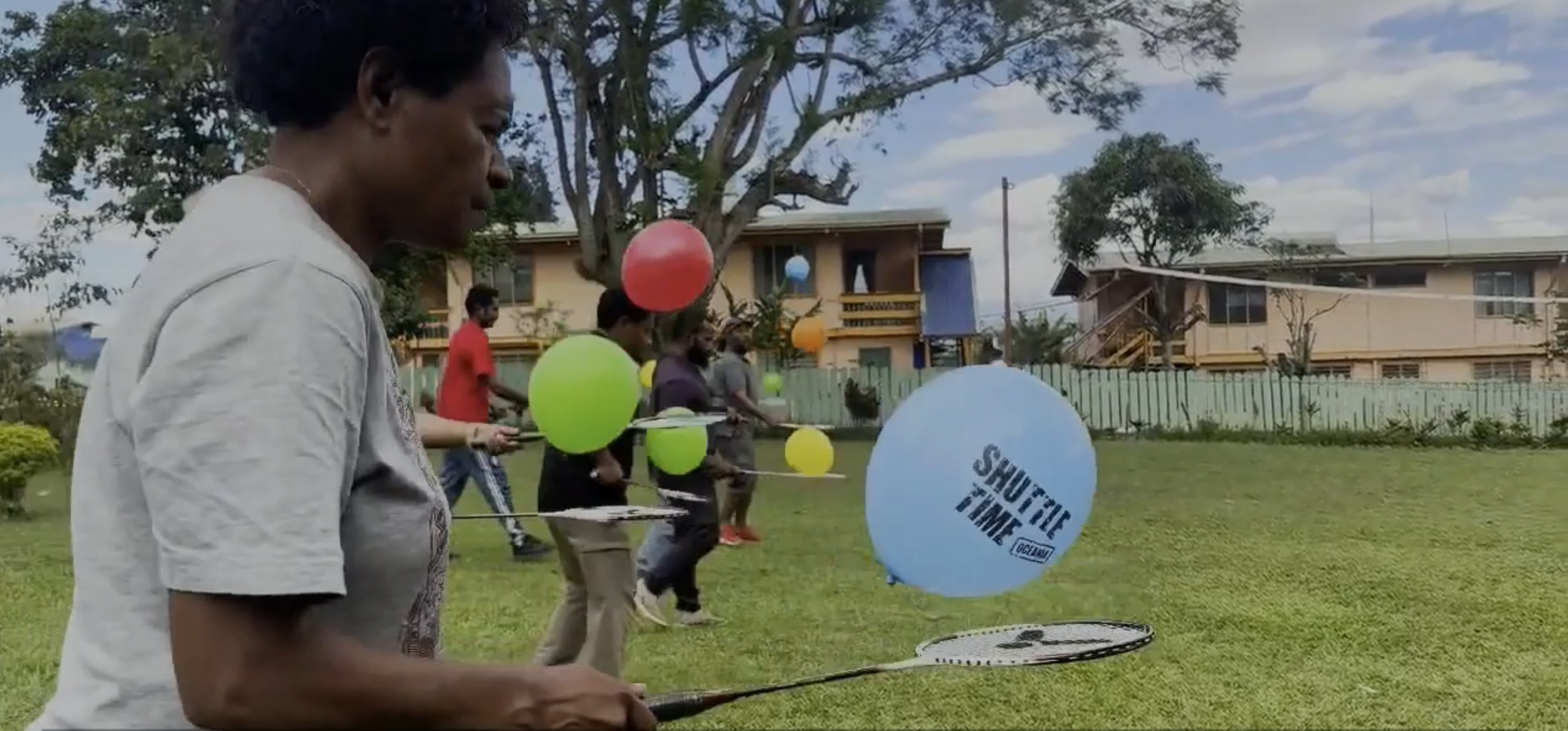 Women playing modified badminton