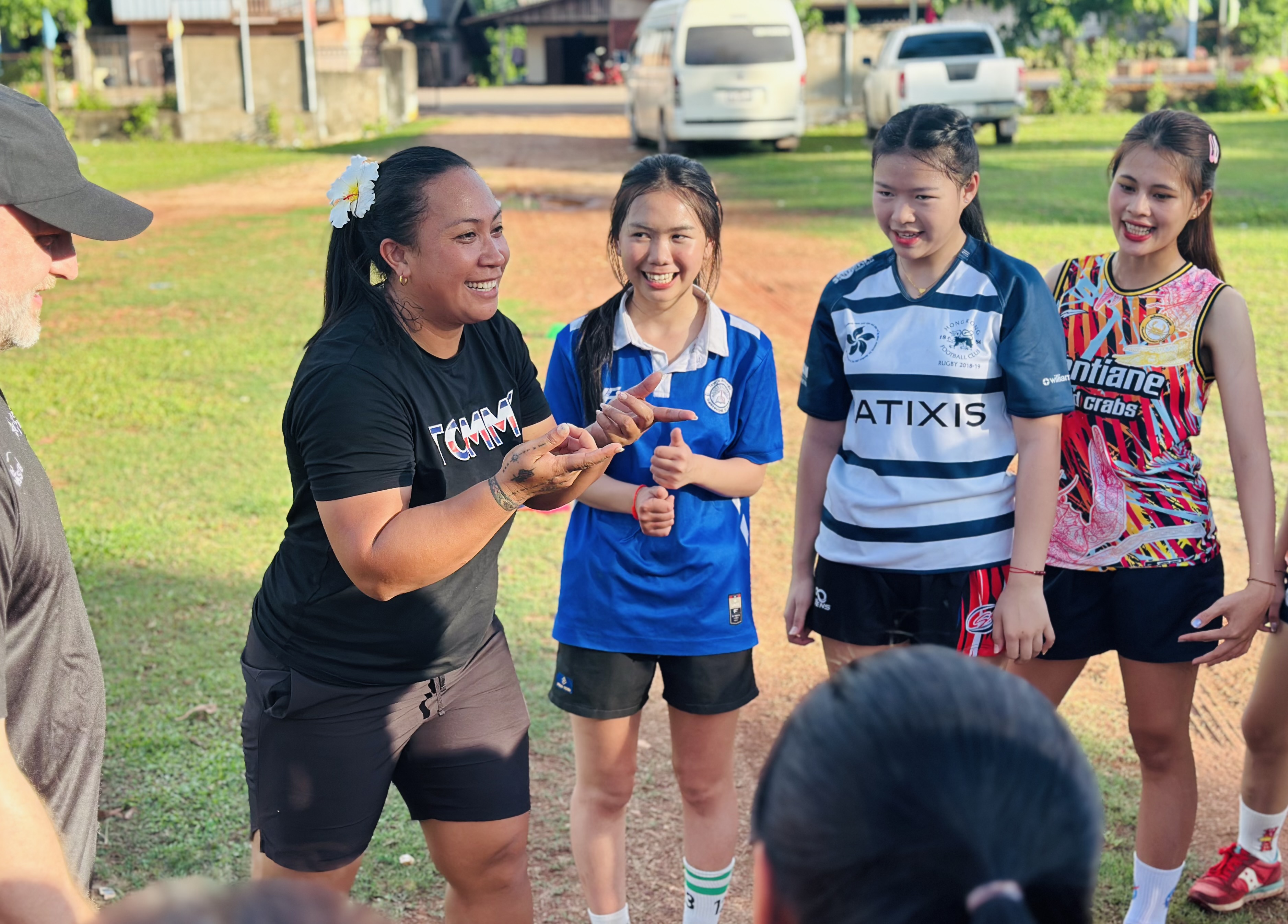 A Pacific woman rugby coach in action 