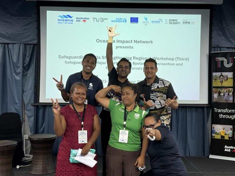 Group of workshop participants smiling at the camera