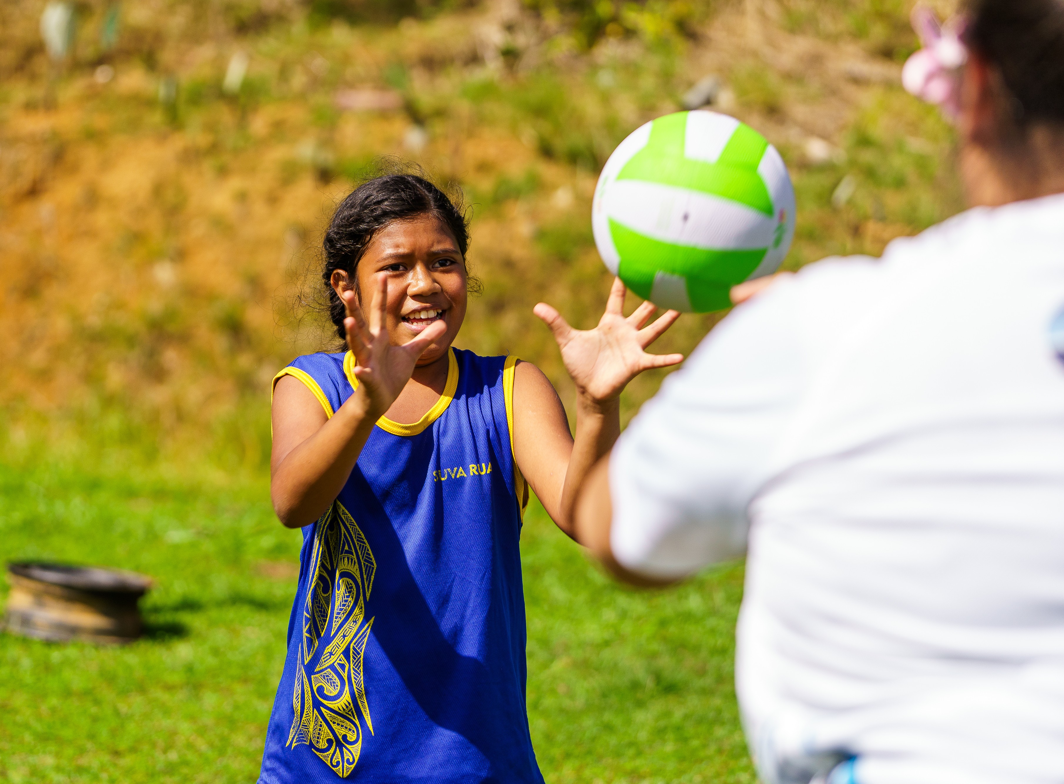 Children practice passes during a netball clinic 